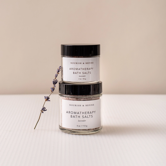 Nourish & Refine lavender bath salts in 2 oz and 4 oz gift sizes with dried lavender sprig