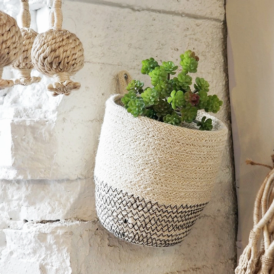 Close-up of textured stitching and woven fibers on mini Korissa jute planter
